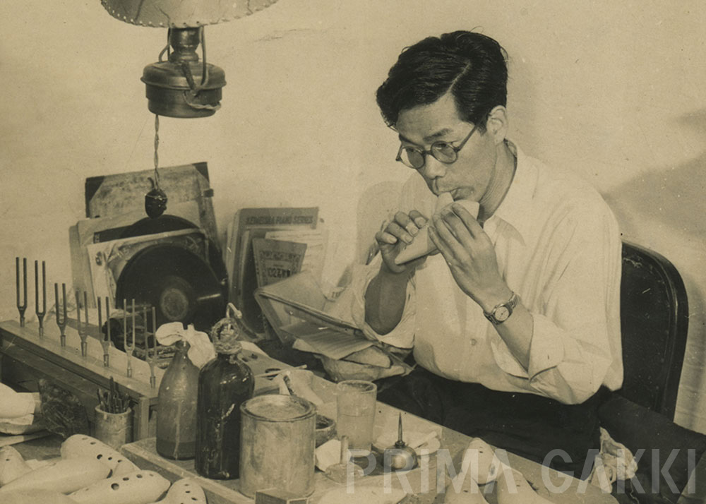 明田川孝氏（写真）